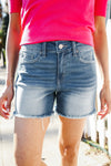 Dark Denim Mid rise raw frayed hem denim shorts