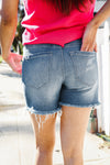 Dark Denim Mid rise raw frayed hem denim shorts