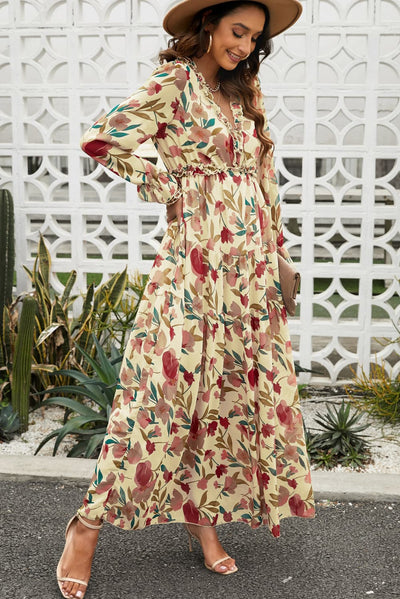 Side view of model wearing size small boho floral maxi dress, showing flowy A-line skirt and flounce sleeves.