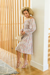  Model Didi wearing Dreamscape pastel floral A-line midi dress in size small, side view