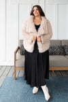Plus size model wearing black modest satin A-line maxi skirt in 1XL