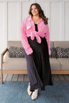 Plus size model wearing black modest satin A-line maxi skirt in 1XL