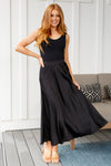 Model wearing modest black satin A-line maxi skirt, size small