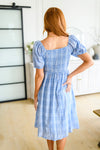 Back of Skylar modest plaid dress with smocked bodice and midi hem