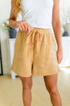 sandy brown beach shorts, modest clothing, modest clothes