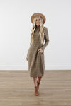 Checkered cocoon modest dress with mock neck, welt pockets, knee-length silhouette, and stretchy knit polyester fabric