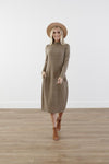 Checkered cocoon modest dress with mock neck, welt pockets, knee-length silhouette, and stretchy knit polyester fabric