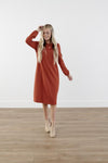 Rich-toned modest knit dress with long puff sleeves, straight silhouette, and knee-length hem, made from cozy polyester-rayon-spandex blend