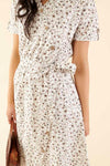 Cotton midi dress with chest pocket, decorative side buttons, elastic waist with sash, and A-line skirt in breathable white fabric