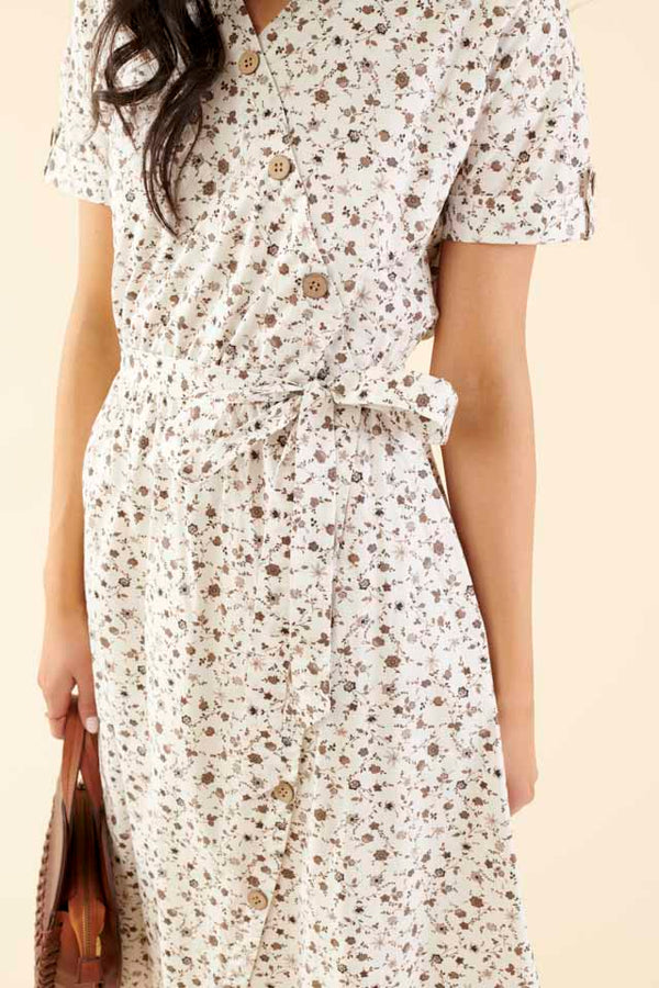 Cotton midi dress with chest pocket, decorative side buttons, elastic waist with sash, and A-line skirt in breathable white fabric