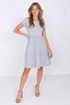  Modest knee-length fit and flare dress with elastic waist in soft polyester-spandex fabric.