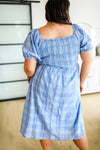 Back view of Skylar blue plaid modest midi dress with elastic smocking and gathered skirt plus size