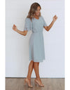 Side of modest chiffon dress with tiered sleeves, soft V-neckline, elastic cinched waist, and knee-length hem in lightweight breathable polyester.